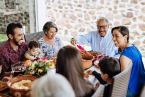 Multigenerational Hispanic family eating together