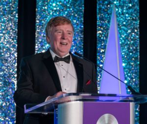 Dr. John Magee on stage at November 2022 Kidney Ball