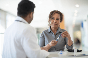 female patient talking with male doctor